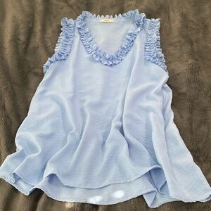 Top with ruffle detail